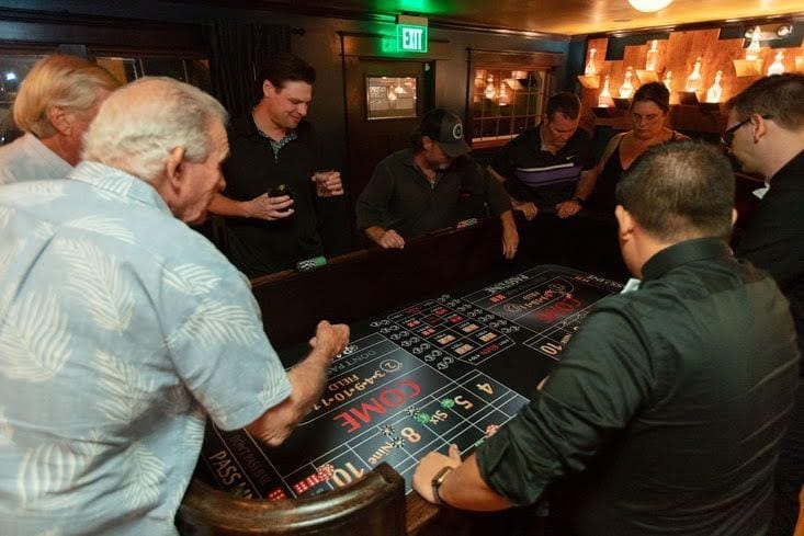 Guests playing craps at a casino night