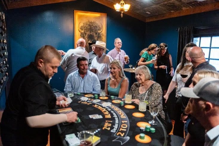 Dealer and guests at the blackjack table