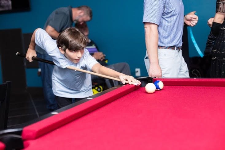 Guests playing pool at a WhiskyWoods event